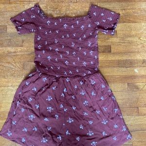 burgundy romper with ribbed top and white flowers